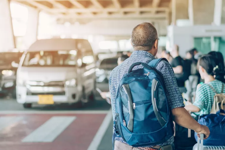 Travelers with luggage at airport